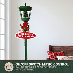 a green lamp post with a merry christmas sign on it and the words, one off switch music control without music