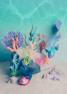 an underwater scene with colorful paper cutouts