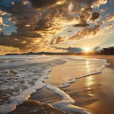 the sun is setting over an ocean beach with waves crashing on it and clouds in the sky