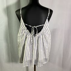 Nwt Loft Blue & White Striped Tie Back Cotton Camisole Ruffle Detail On The Collar. Tie Detail On The Back. Adjustable Spaghetti Straps. Fully Lined. New With Tags, Excellent Condition. Size Large Petite Length: 24 Inches Bust: 20 Inches *Measurements Taken Lying Flat V-neck Tie Back Tank Top For Beach, Spring Beach Tops With Built-in Bra, Cotton Camisole With Built-in Bra For Vacation, Summer Tie Back Tank Top For Day Out, Summer Cotton Tops With Built-in Bra, Summer Sleeveless Blouse With Tie Back, Sleeveless Tie Back Blouse For Summer, Tie Back Sleeveless Blouse For Summer, Blue Sleeveless Tank Top With Tie Back