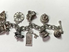 . Spectacular Wedding themed charm bracelet. 6 of them open! 4 have movable parts! Toggle clasp. Fantastic wedding gift! 7 1/2 inches Bird in a cage, opens Baby in a basket, opens Stork with baby, moves Wedding bells Home, opens I love you phone dial, moves Telephone Carriage, opens Door and key Baby in carriage, moves Carousel, moves Wedding cake, opens Wedding cake with enamel bride and groom, opens 66.42 grams sterling silver Metal Charms Jewelry For Wedding, Elegant Metal Charm Bracelet Collectible, Elegant Metal Charm Bracelet For Collectors, Silver Jewelry With Dangling Charms For Wedding, Vintage Silver Charm Bracelet For Wedding, Silver Charm Bracelet For Formal Occasions, Collectible Themed Silver Jewelry, Themed Silver Collectible Jewelry, Nickel Free Silver Charm Bracelet For Wedding