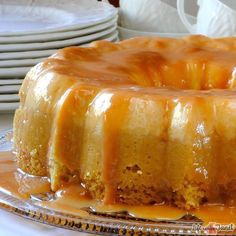 a cake sitting on top of a plate covered in caramel sauce