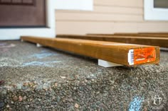 a close up of a wooden object on the ground