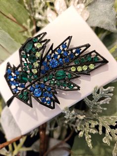 "Signed \"Art\" Vintage Mid-century Modernist Leaf Brooch with Green & Blue Rhinestone leaf brooch and Japanned setting. A wonderful piece, the brooch is marked Art and is in excellent vintage condition. Size - Approx. 2 3/4\" long  <3 All of our items are pre-loved, vintage, and antique. Please review pictures carefully. Pictures are enlarged and colors and sizes might not be exact. Please understand that all items are purchased as is and, unfortunately we can't be responsible for buyer's remor Green Brooch, Art Mid Century, Crystal Bead Necklace, Leaf Brooch, Black Bead Necklace, Moon Glow, Crystal Brooch, Blue Rhinestones, Vintage Yellow