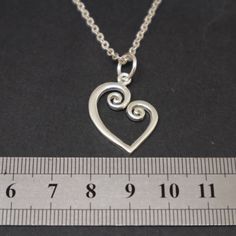 "Sterling Silver Spiral Heart Ring Holder Necklace for you to hold your wedding or engagement ring if you're not wearing it. The engagement ring is not included for the purchase. Base Material: 925 Sterling Silver Depth: 19 mm (W) X 22 mm (H) (Approximately) Metal Stamped: 925 Thickness: 1.5mm (Approximately) Chain Length: 16'' - 24'' Inches SPECIAL ANNOUNCEMENT 1. Please visit https://www.etsy.com/shop/yhtanaff for more designs. 2. Subscribe our newsletter to receive a Coupon Code for 10% disco Spiral Sterling Silver Jewelry For Anniversary, Spiral Sterling Silver Jewelry For Wedding, Spiral Sterling Silver Wedding Jewelry, Ring Holder Necklace, Mother Daughter Bracelets, Anniversary Gift For Wife, Elephant Bracelet, Daughter Mother, Anniversary Gifts For Wife