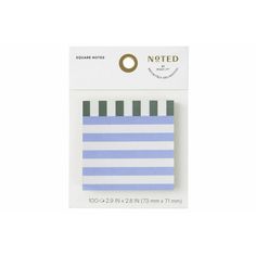 a small blue and white striped notepad