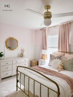 a bed room with a neatly made bed and a ceiling fan in the middle of it