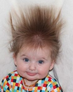 a baby with a mohawk on top of it's head