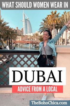 a woman standing on top of a bridge with the words what should women wear in dubai advice from a local