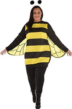 a woman in a bee costume is walking with her arms out and legs spread wide