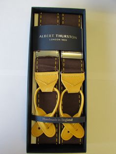 Albert thurston limited edition brown & yellow stitch design. rigid braces. yellow goat leather ends, silver fittings with buttons in the box. one size fully adjustable. brand new handmade in england. exclusive to taggs bespoke. Brown Leather Belts And Suspenders For Gift, Brown Leather Belts And Suspenders As Gifts, Brown Leather Belt And Suspenders For Gift, Brown Leather Belt And Suspenders As Gift, Adjustable Brown Belts And Suspenders For Business, Yellow Stitch, Goat Leather, Stitching Leather, Stitch Design