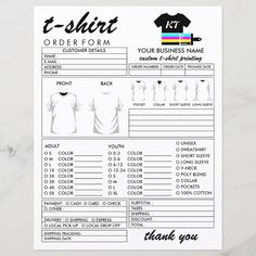 a t - shirt order form is shown on a marble surface