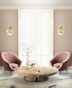 an elegant living room with pink chairs and a round coffee table in the center area