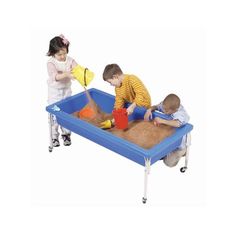 three children playing in a sand and water table