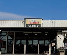 the front entrance to a restaurant that is closed for business on a clear day with blue skies in the background