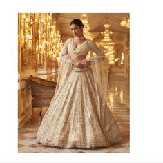 Excellent Condition / Worn Once This Was Ordered Through The Shop Kynah Website. This Luxurious Ivory Gold Sequin Lehenga Set Features A Stunning Geometric Pattern Adorned With Delicate Embroidery And Shimmering Sequins. The Full Sleeve Blouse Is Adorned With Pearl And Crystal Tassels At The Waist And Wrist. The Set Is Completed With A Matching Four Sided Embroidered Dupatta For Timeless Style. What's Included: - Blouse - Skirt - Dupatta Standard Size: Small Waist: 28 Hips: 38 Skirt Length: 42 Sequin Lehenga, Seema Gujral, Full Sleeve Blouse, Blouse Skirt, Delicate Embroidery, Embroidered Dupatta, Gold Sequin, Small Waist, Full Sleeve