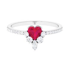 a heart shaped ruby and diamond ring in white gold with diamonds on the sides,