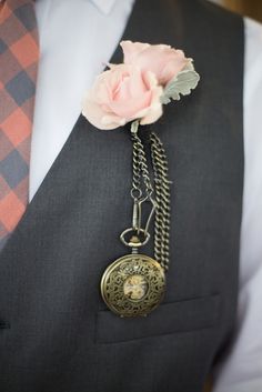 a man in a suit with a flower on his lapel