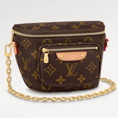 The Mini Bumbag In Monogram Canvas Is Louis Vuitton's Feminine Interpretation Of The On-Trend Bumbag Format. Designed For Versatility, It Features A Removable, Adjustable Strap In The House's Emblematic Natural Leather, As Well As A Removable Gold-Tone Chain, Which Can Be Functional Or Decorative. The Bag Has A Zipped Main Compartment And A Zipped Front Pocket With An Embossed Leather Tag. New With Box, Dust Bag. Monogram Canvas Belt Bag With Detachable Strap, Monogram Canvas Crossbody Belt Bag For Travel, Everyday Monogram Canvas Crossbody Belt Bag, Travel Belt Bag In Monogram Canvas With Dust Bag, Travel Belt Bag With Removable Monogram Canvas Pouch, Monogram Canvas Belt Bag With Removable Pouch, Brown Monogram Canvas Belt Bag With Gold-tone Hardware, Luxury Monogram Canvas Belt Bag With Detachable Strap, Luxury Monogram Canvas Rectangular Belt Bag