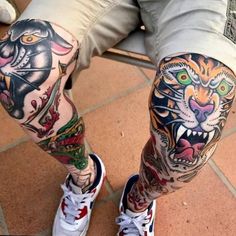 a man's legs with tattoos on them and an image of a tiger in the middle