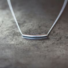 Silver Bar Necklace Curved Tube Necklace Classic by ShopClementine Minimalist Everyday Bar Necklace With Delicate Chain, Minimalist Everyday Bar Necklace, Everyday Minimalist Bar Necklace, Minimalist Bar Necklace With Adjustable Chain For Everyday, Dainty Sterling Silver Bar Necklace For Everyday, Minimalist Necklace With Delicate Chain For Everyday, Simple Bar Necklace With Delicate Chain, Silver Bar Necklace With Delicate Chain For Everyday, Silver Dainty Bar Necklace For Everyday