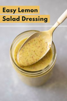 an easy lemon salad dressing in a jar with a spoon