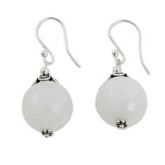 Globes of milky white chalcedony reveal subtle honeycomb facets. Narayani designs handcrafted earrings of sterling silver to showcase the lovely gems. .925 Sterling silver Nickel-free White Spiritual Jewelry, Spiritual White Nickel-free Jewelry, Spiritual Nickel-free White Jewelry, Chalcedony Natural Stone Drop Earrings, Chalcedony Drop Earrings With Natural Stones, Chalcedony Dangle Jewelry With Matching Earrings, Chalcedony Dangle Earrings With Matching Jewelry, White Moonstone Earrings, Elegant Hypoallergenic Moonstone Jewelry