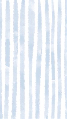 a white and blue striped wallpaper with watercolor paint streaks on it's surface