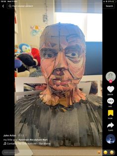 an image of a paper mache that looks like a man's face and chest