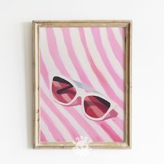 a pink and white painting with sunglasses on it