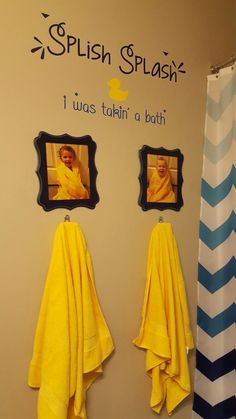 two yellow towels are hanging on the wall