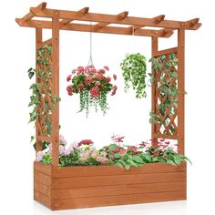 a wooden planter filled with lots of flowers