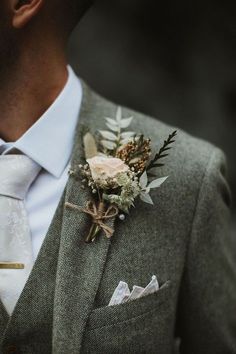 a man in a suit with a boutonniere on his lapel