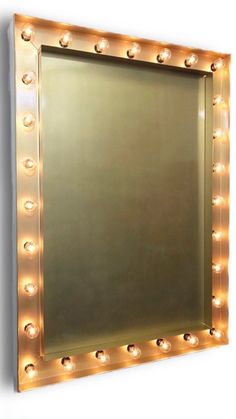 a large mirror with lights on it