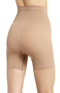 Sculpt your body's natural shape with shaping shorts that hit just above the knee with a whisper-soft and seamless design from Kim Kardashian's SKIMS. Reflecting the brand's passion for highly technical shapewear solutions for every body, this staple piece smoothes your upper legs while lifting your butt and comes in different shades to complement your skin tone. 5" regular inseam Cotton-lined gusset 82% nylon, 18% elastane Machine wash, tumble dry Made in Turkey Seamless Mid-thigh Shapewear, Beige Compressive Shapewear Shorts, Beige Seamless Mid-thigh Shapewear, Beige Compressive Mid-thigh Length Shapewear, Micro-elastic Beige Shapewear Bottoms, Mid Thigh Shorts, Natural Shapes, Fabric Gift Bags, Staple Pieces