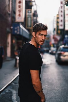 a man standing in the middle of a street