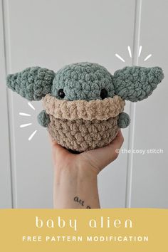 a crocheted baby yoda doll is shown with the text, baby alien free pattern