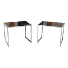 pair of chrome and black glass side tables