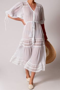 100% Cotton Color: Pure White Rope Belt Center front button closure Hand Wash Imported Our new Nolina gauze dress stands up to the summer heat. Grab a hat and wear it open and flowy over your bikini on the beach or button it up and tie the rope belt for a quick trip to the market or to brunch. The pretty sleeve ties and lace details also add a touch of drama to those sultry summer nights. Dress Stands, Boho Beachy, White Rope, Rope Belt, Gauze Dress, Summer Heat, The Pretty, Pure White, Summer Nights