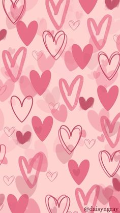 pink and red hearts are arranged in the shape of heart shapes on a pink background