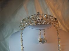 Handmade swarovski wedding tiara Adrienne set on a silver band also available in gold roughly 1 1/2 " tall ,this tiara is made using a mixture of ⁰ swarovski and presiosa crystals and pearls  clear pear and navette swarovski diamante stones ivory/white presiosa  pearls ,a stunning tiara  lots of sparkle and , also,shown in the pictures with the matching jewellery also available in my shop . Elegant Silver Crown For Wedding, Elegant Crystal Crown For Wedding, Silver Rhinestone Wedding Crown, Silver Wedding Crown With Rhinestones, White Crown Design Jewelry For Wedding, Elegant Teardrop Crown For Wedding, Elegant Wedding Crown With Teardrop Shape, White Wedding Crown With Pinched Shape, White Pinched Crown For Wedding