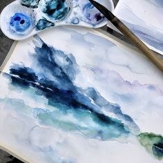 watercolors are being used to create an abstract painting