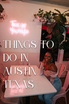 a woman sitting at a white table with the words things to do in houston texas