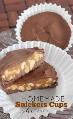 two homemade snickkers cups sitting on top of a paper plate