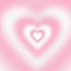 a heart shaped object is shown in pink and white