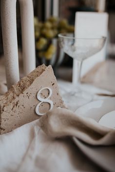 Travertine Stone and White Wedding Table Number Stone Numbers Wedding, Table Numbers Stone, Granite Table Numbers, Concrete Table Numbers, Ceramic Table Numbers, Stone Wedding Table Numbers, Diy Stone Table Numbers, Stone Wedding Signage, Marble Wedding Decor