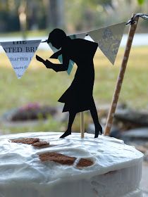 a cake with a silhouette of a man holding a flag