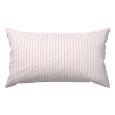 a pink and white striped pillow on a white background