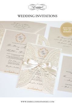 the wedding stationery is shown with an elegant bow and ribbon on top of it