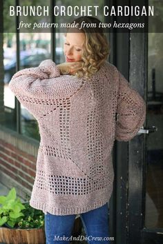 a woman wearing a pink sweater and jeans standing in front of a storefront with her hands on her hips